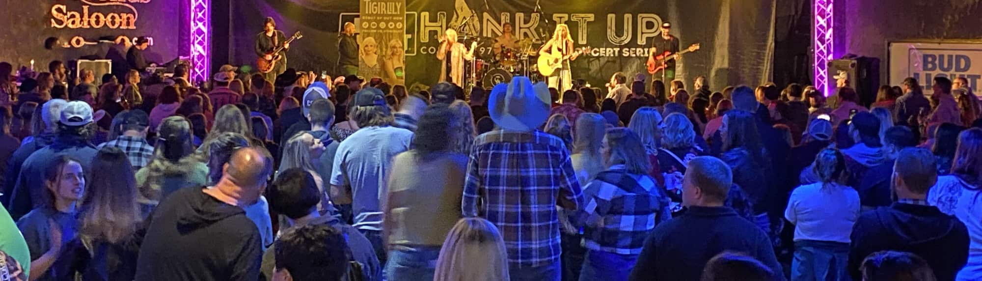country concert with fans wearing cowboy hats Wichita