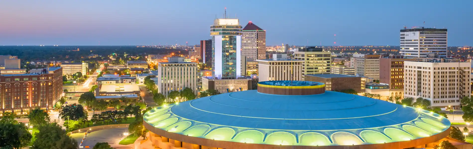 Neon color image of a band playing and people singing along